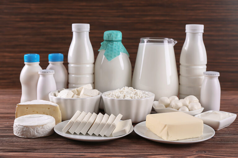 Different dairy products on wooden table